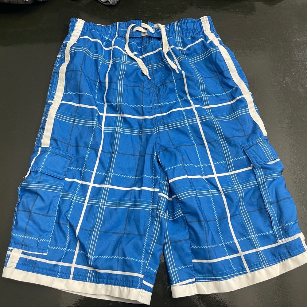 Blue and white burnside swim trunks. Size kids large.